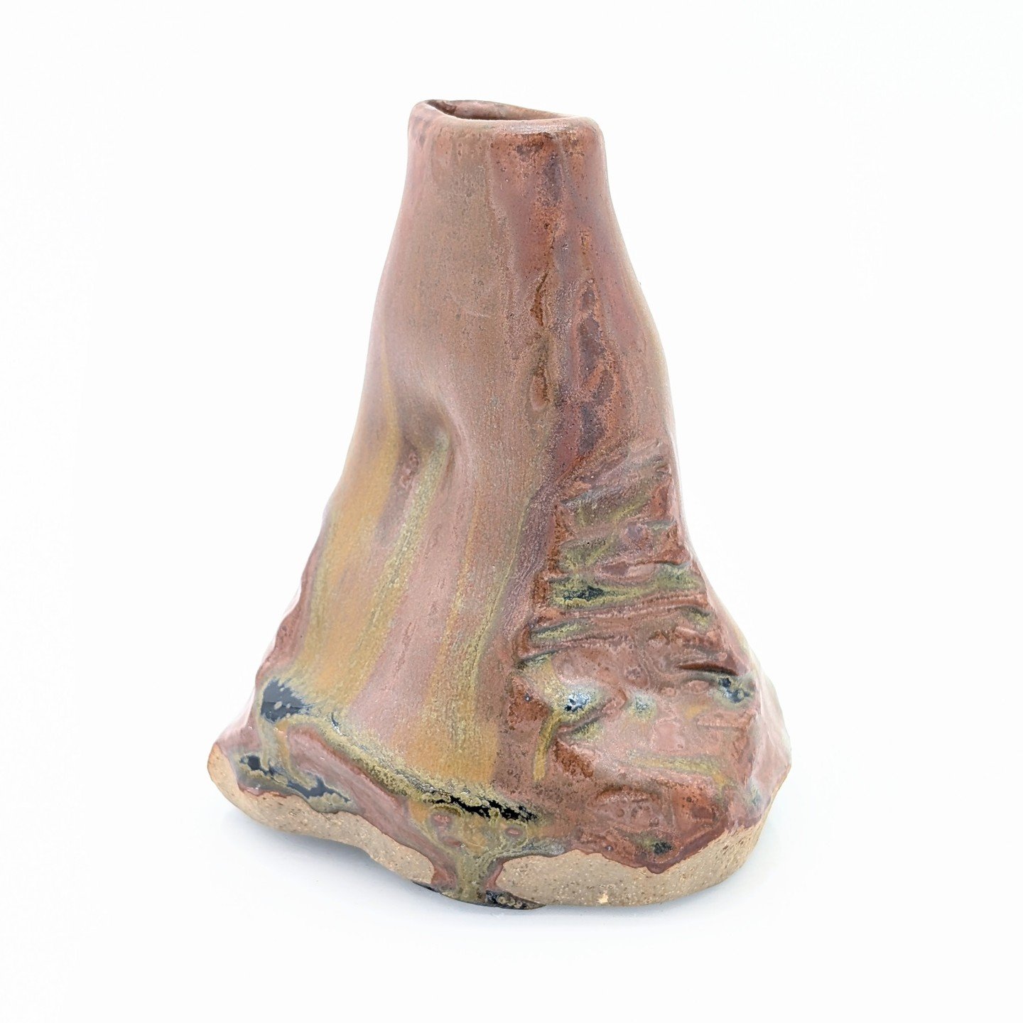 Another altered form, loosely inspired by rock formations. I used a woodash glaze and brushed rutile and cicada ash on before firing. 

I love how the stains flowed, highlighting the carved texture and the beautiful earth tones.

-
#art #pottery #cla