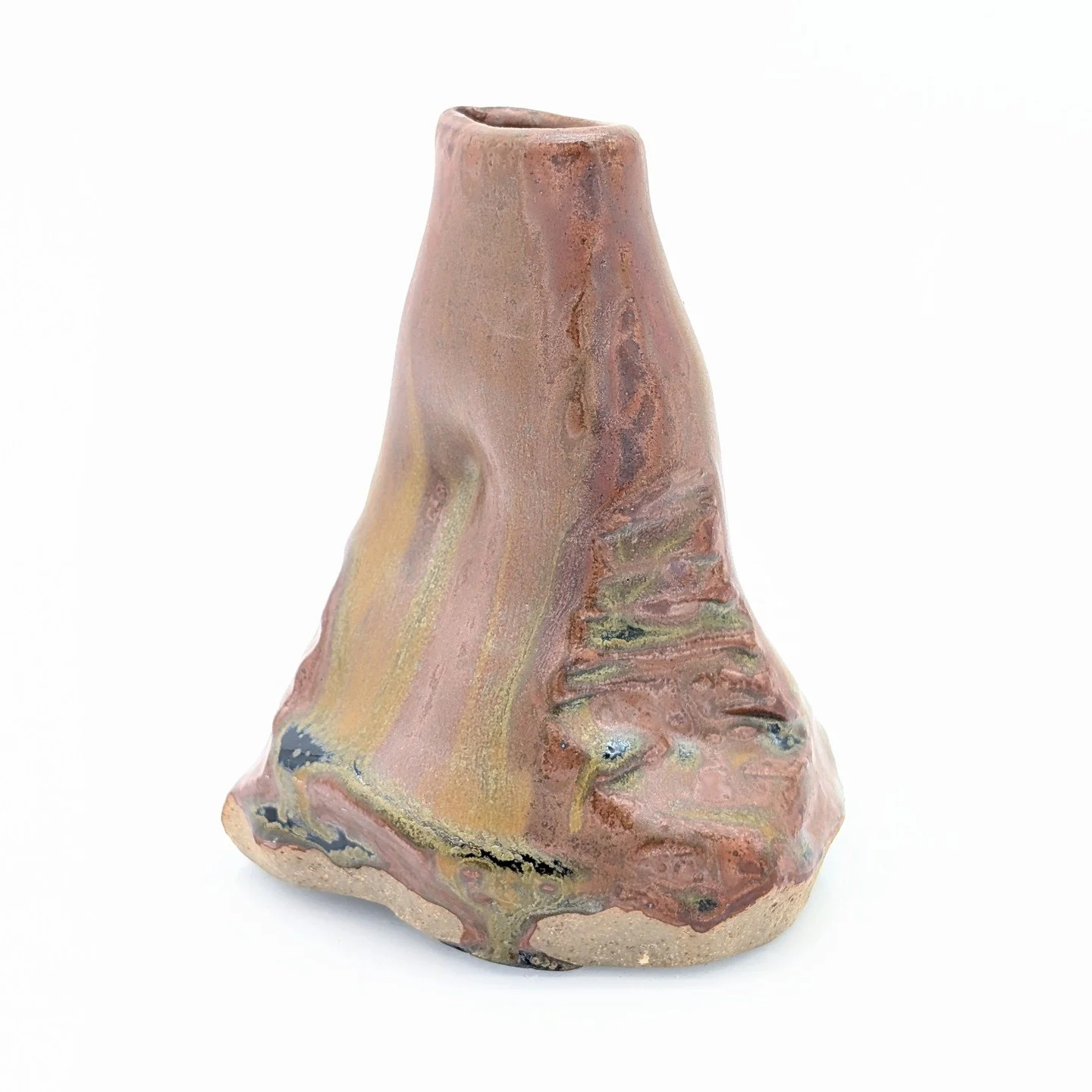 Another altered form, loosely inspired by rock formations. I used a woodash glaze and brushed rutile and cicada ash on before firing. 

I love how the stains flowed, highlighting the carved texture and the beautiful earth tones.

-
#art #pottery #cla