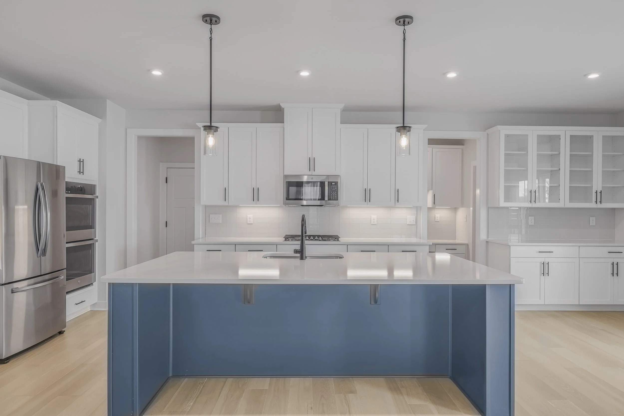 A luxurious kitchen equipped with top-of-the-line appliances, including a professional-grade stove and refrigerator.