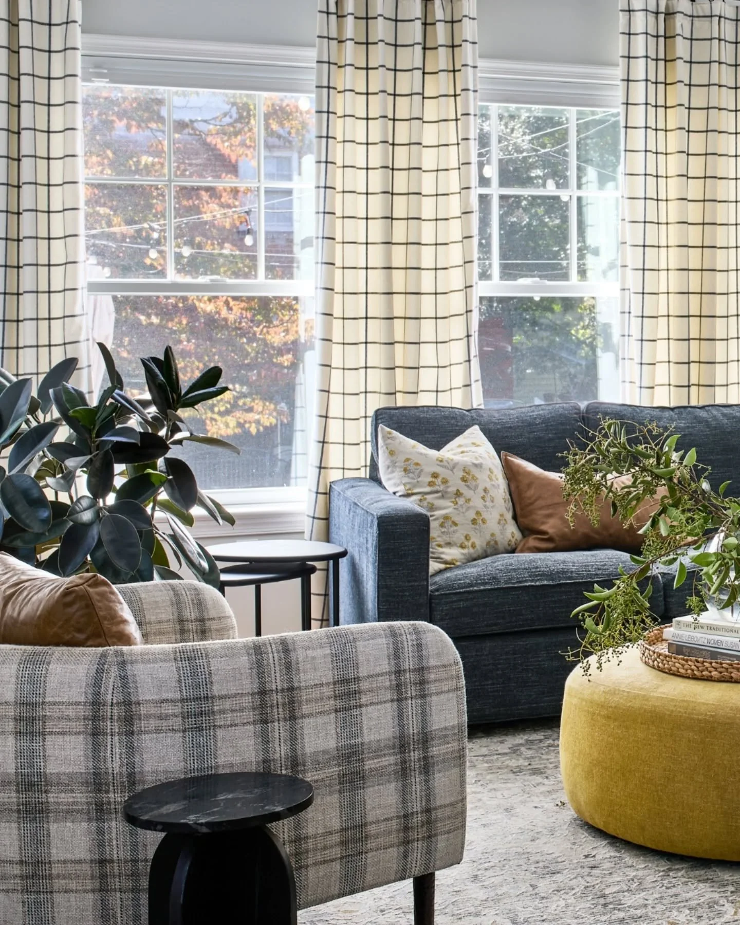 Fall has officially arrived in DC - the leaves are turning, the air is crisp, and cozy nights are here. This space was designed to layer warmth through window pane pattern drapery, a plaid armchair, and soft textiles, balanced with a touch of leather