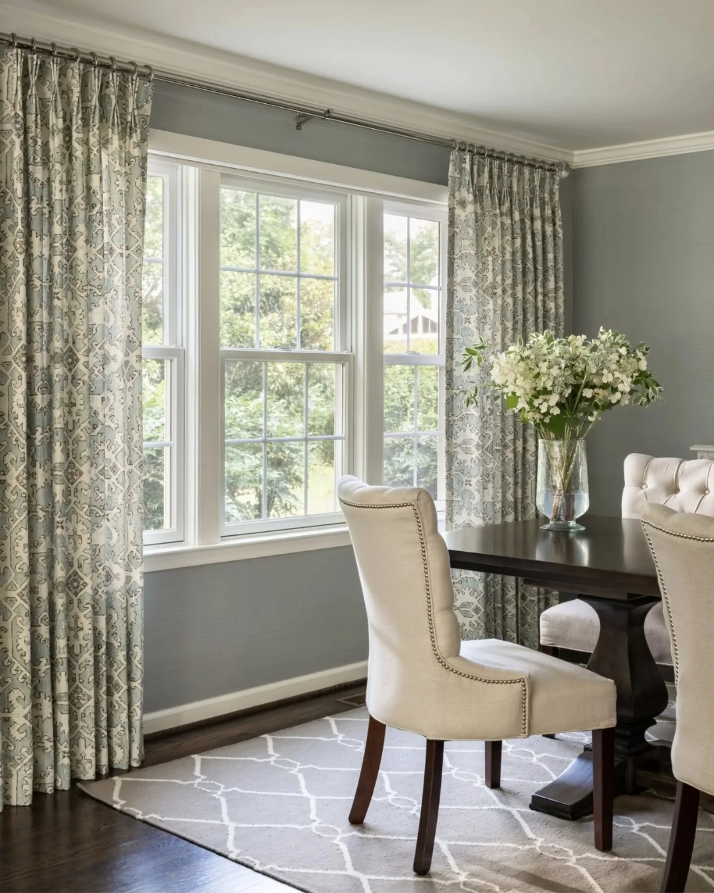 This dining room didn&rsquo;t need a full redesign&mdash;just a few thoughtful updates to bring it back to life. New wallpaper adds texture and color, while custom window treatments introduce a subtle pattern, frame the light, and soften the space. T