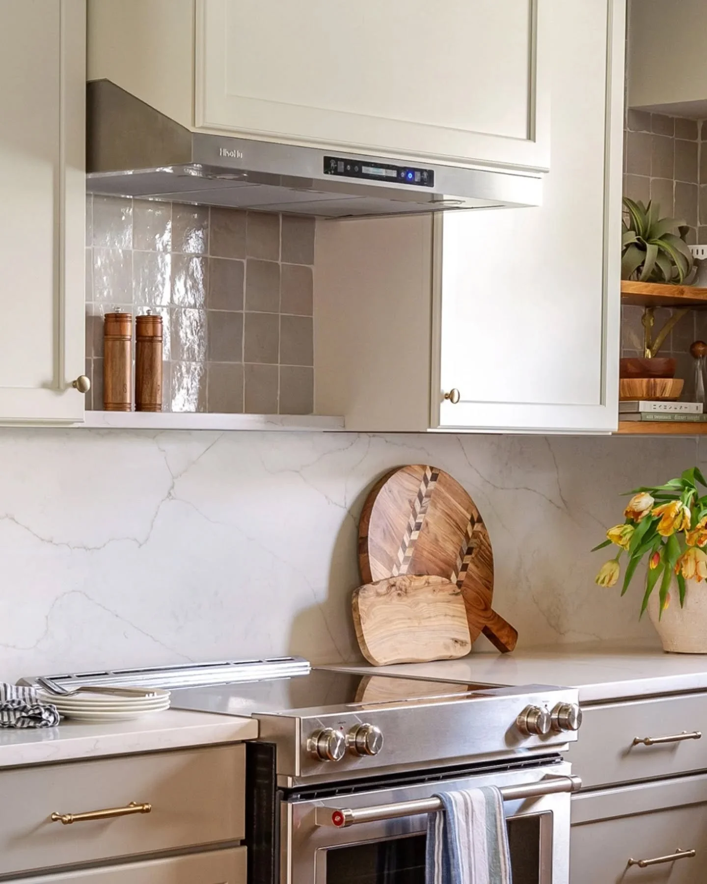 In my designs, it&rsquo;s always the details that matter. For this kitchen, the client wanted to stay within a neutral palette, so we played with texture to add depth and warmth. The handmade zellige tile, veining in the quartz, exposed brass bracket