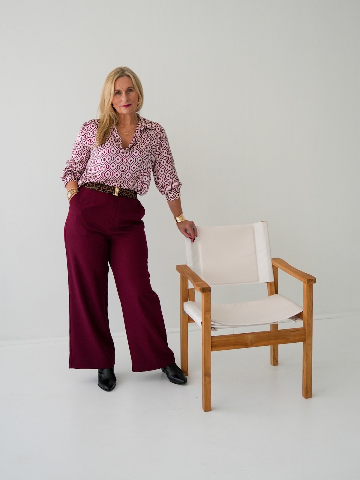 Therapist Michelle Cuneo in her Central Coast therapy studio at Red Thread Relationships, presenting a calm, grounded aesthetic for relationship counselling.