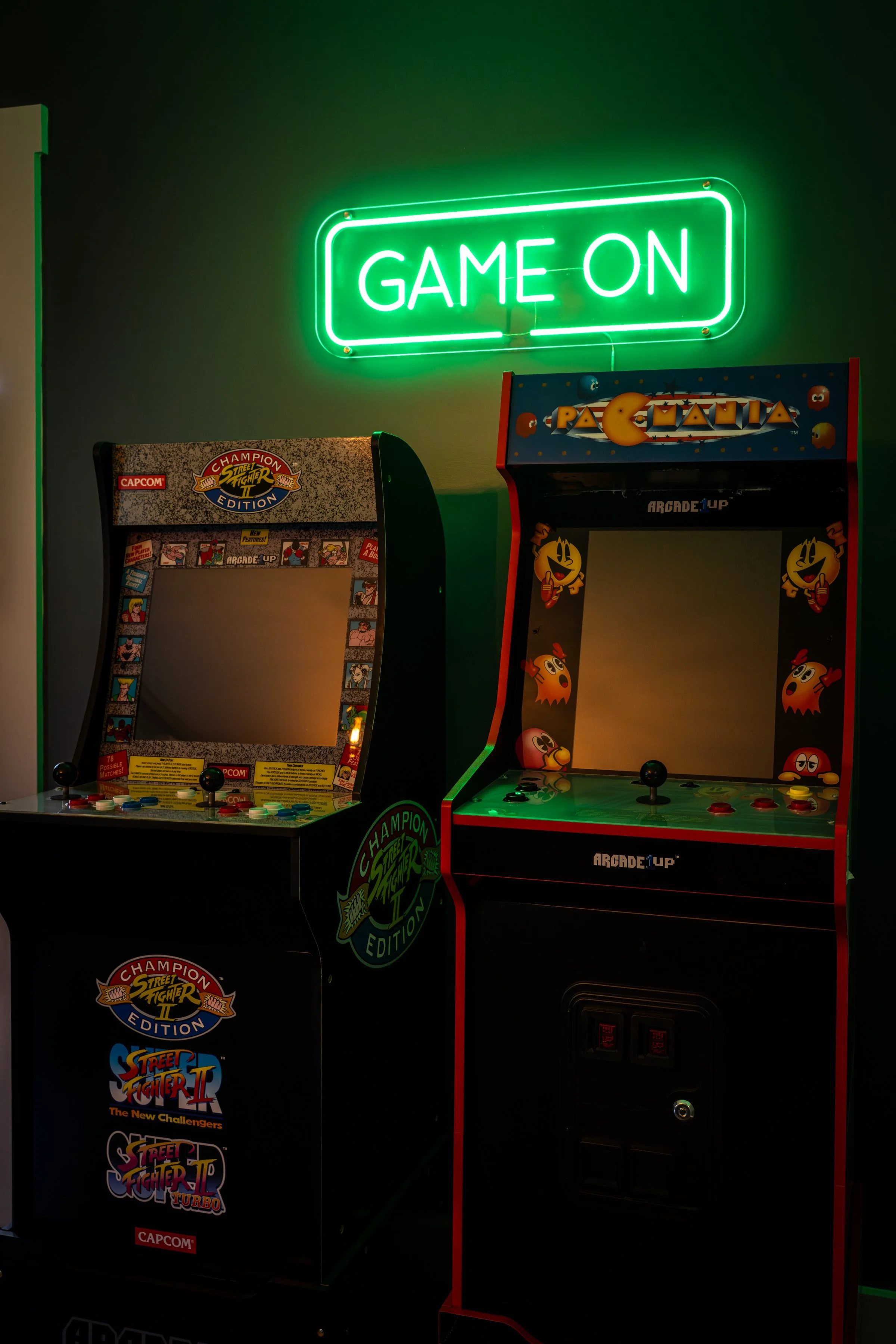 Arcade games with a glowing Game On neon sign