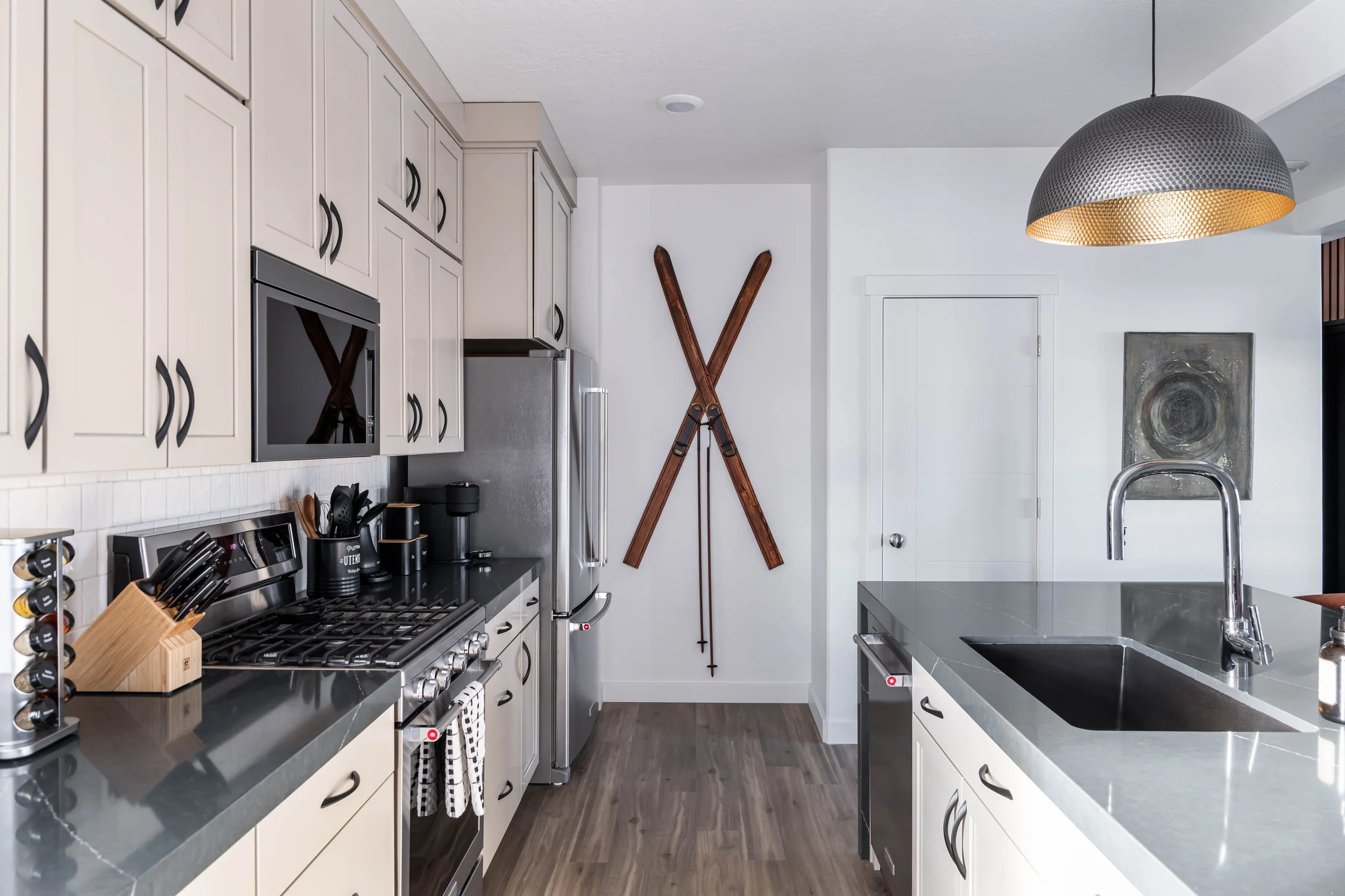 Modern kitchen remodel by Kelsey Brown Interiors in Santa Cruz, California featuring custom cabinetry, quartz countertops, and contemporary finishes.