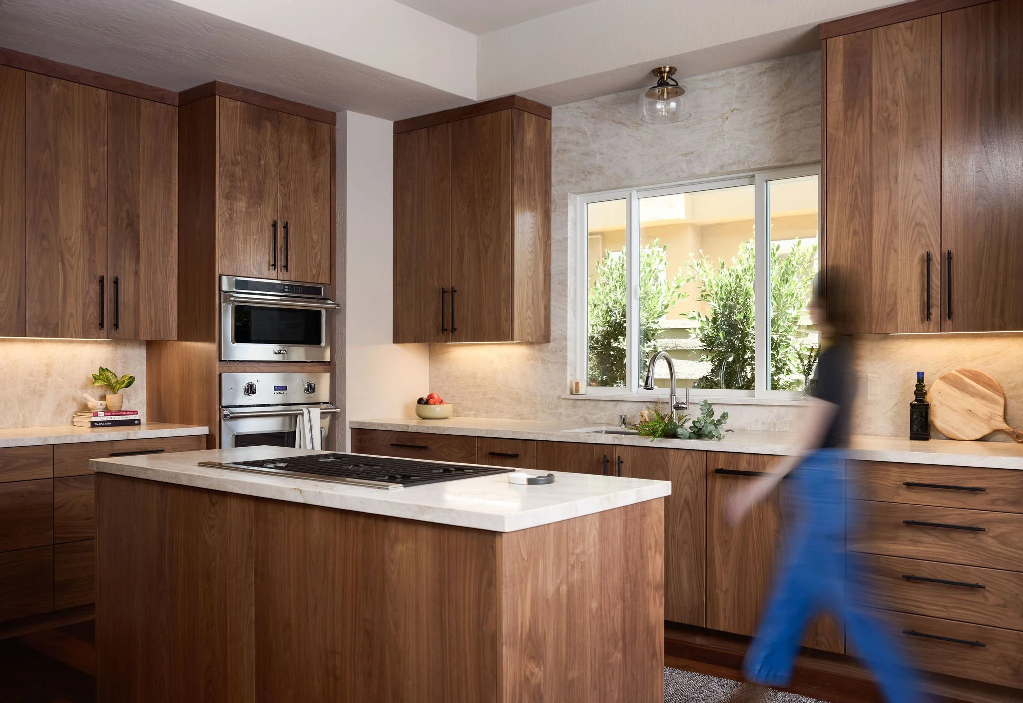 tide-timber-kitchen-modern-organic-walnut-cabinets-with-person.jpg