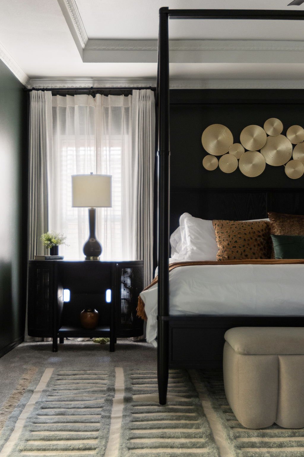 Primary bedroom vignette in a short-term rental, designed by Kelsey Brown Interiors. 