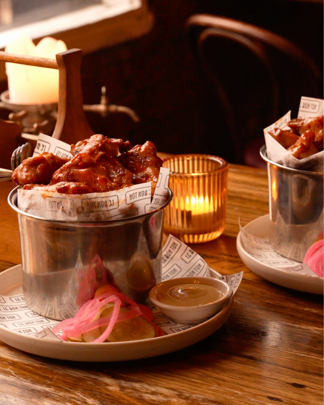 Buckets of Chicken wings and served with dipping sauces at Le Bon Ton.