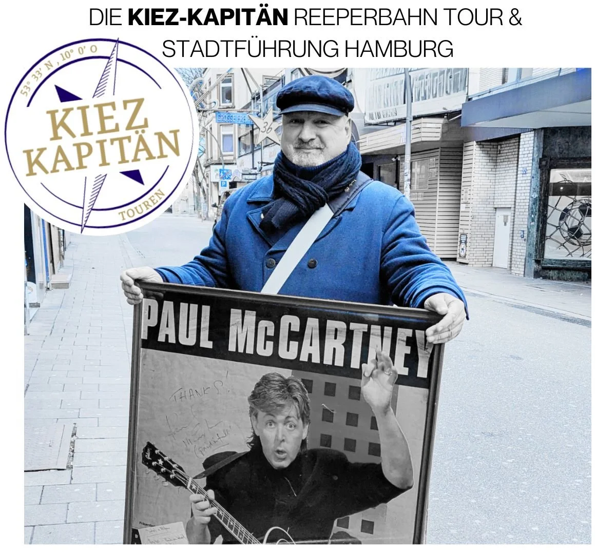 Der Kiez-Kapitän hält ein Plakat mit einem Bild von Paul McCartney.