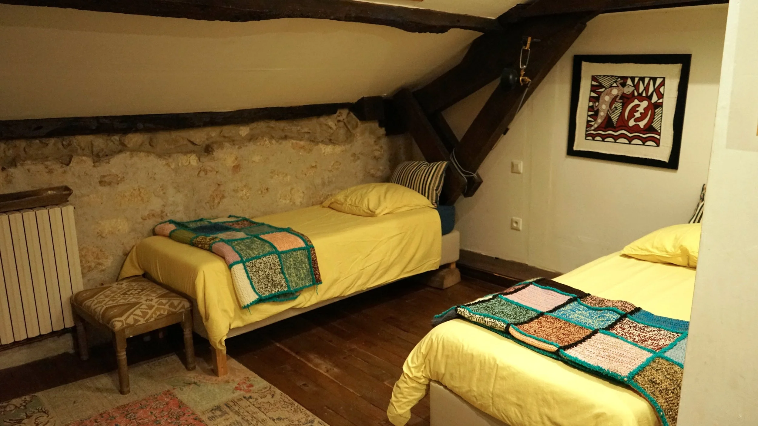 A cozy bedroom with two separate beds