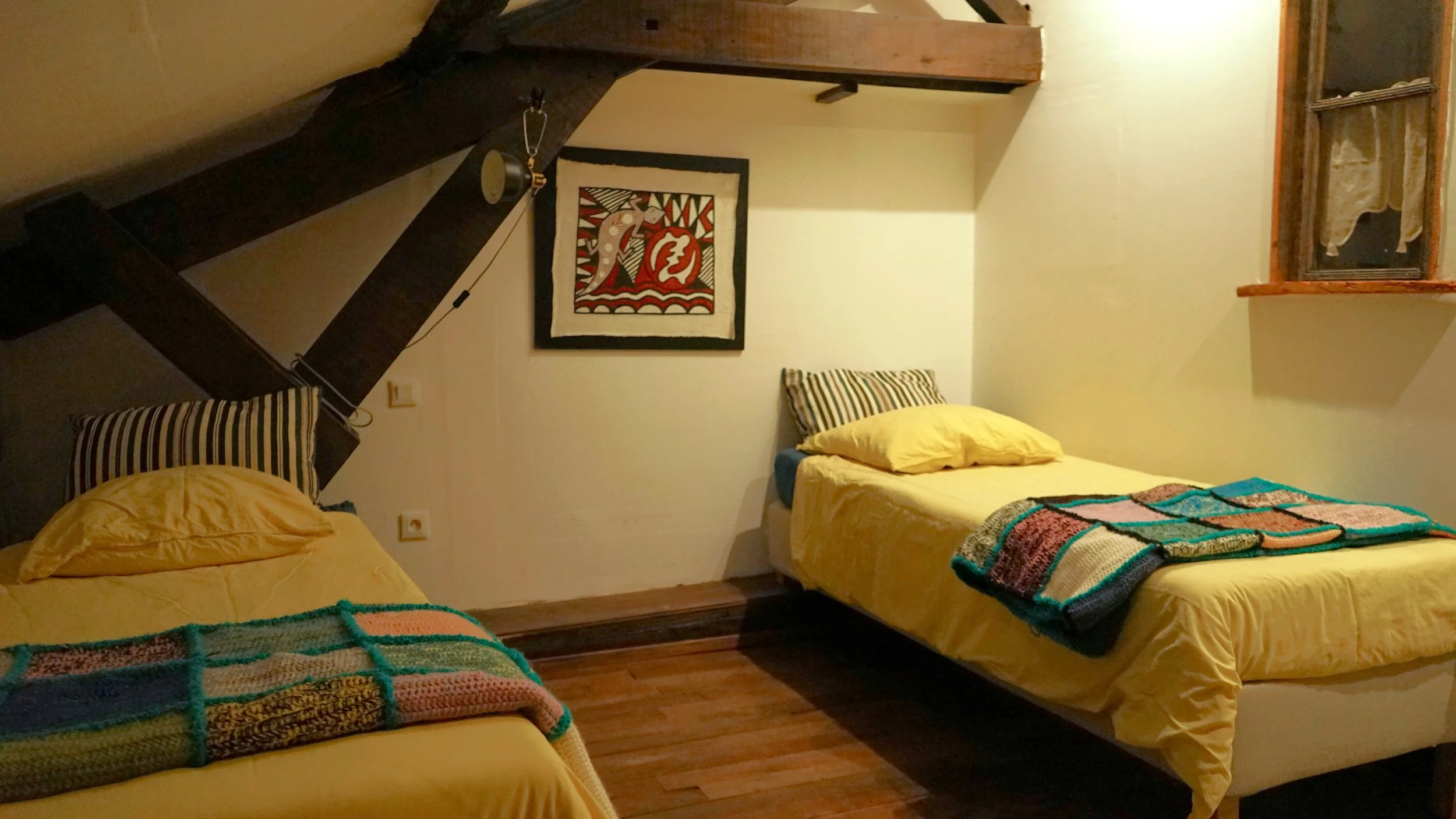 A cozy bedroom with two separate beds