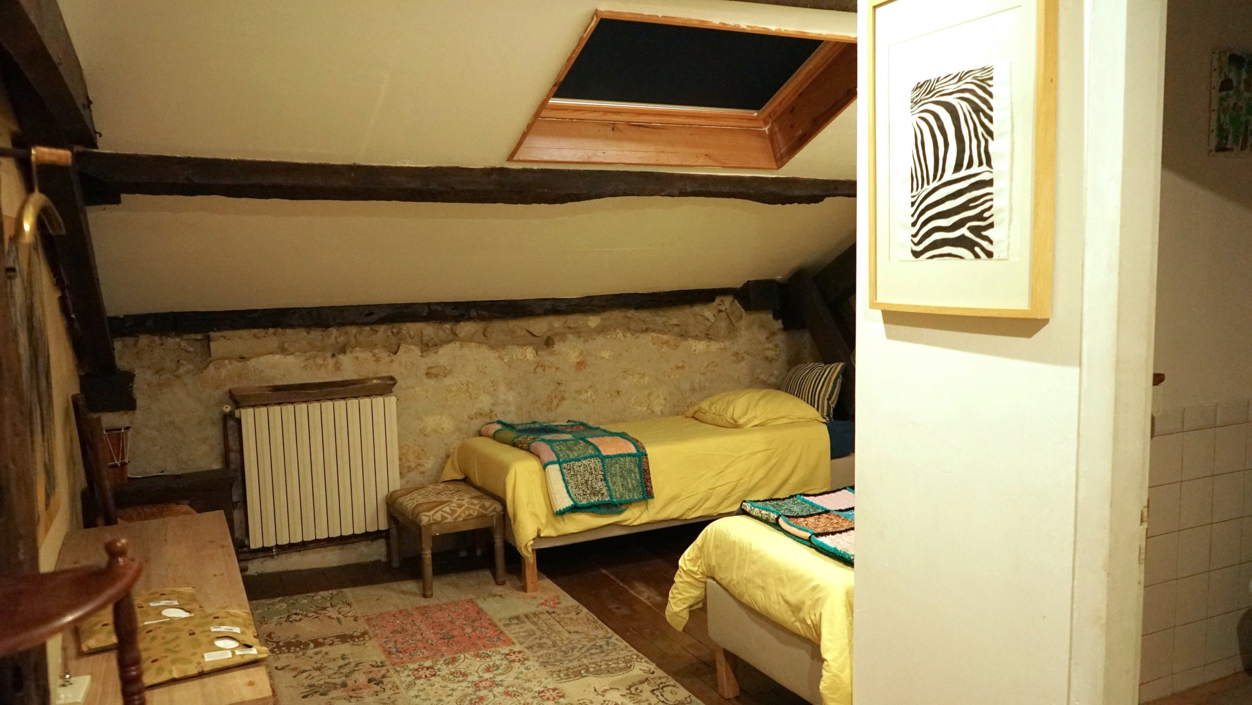 A cozy bedroom with two separate beds