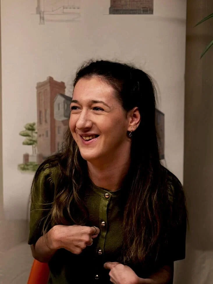 24/Three Orla, Architechtural Assistant smiling at her desk