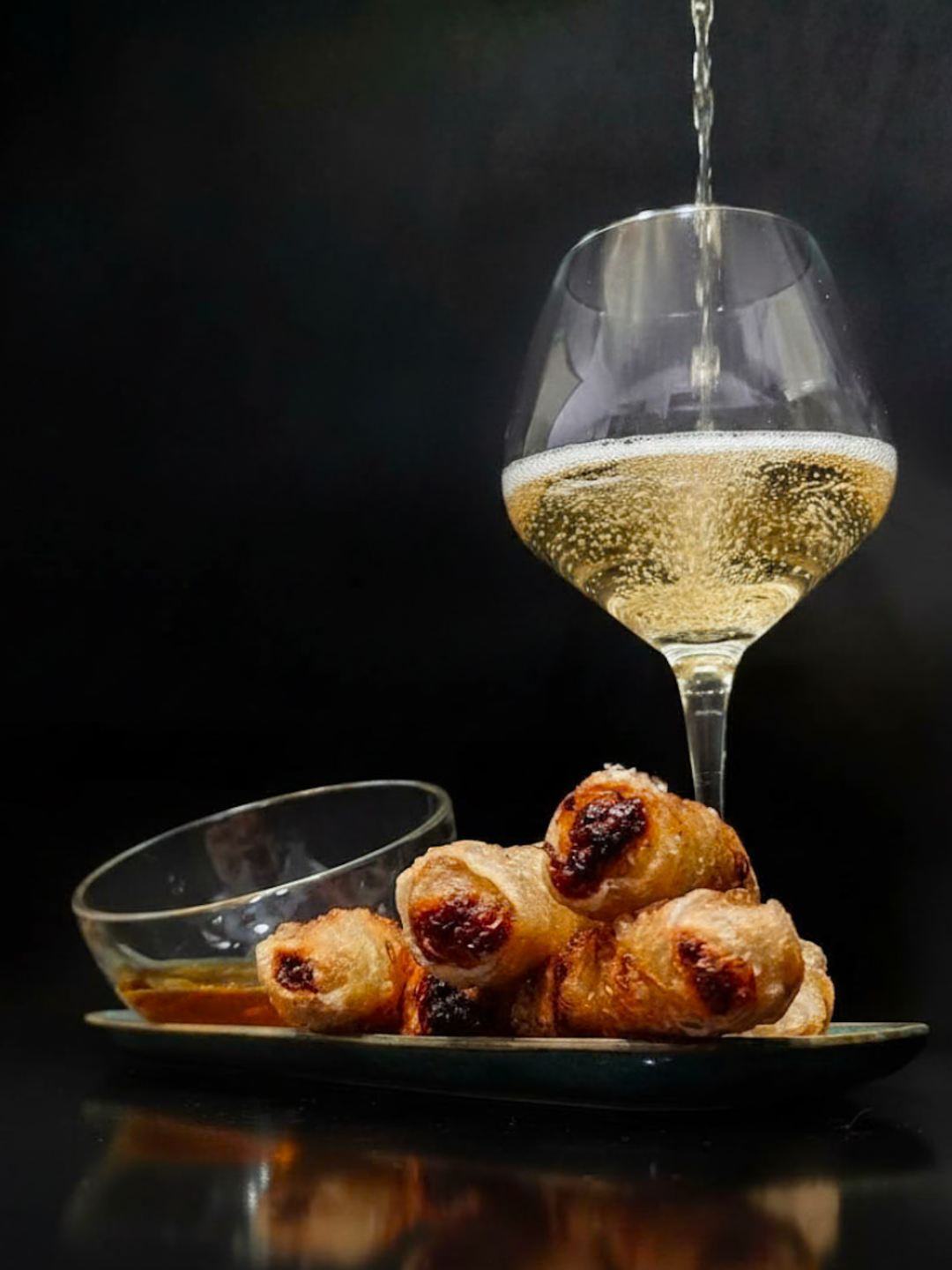 Crispy, spiced vegetable samosa rolls served alongside a glass of Aimery Blanquette de Limoux Brut, the pairing that started this tasting.