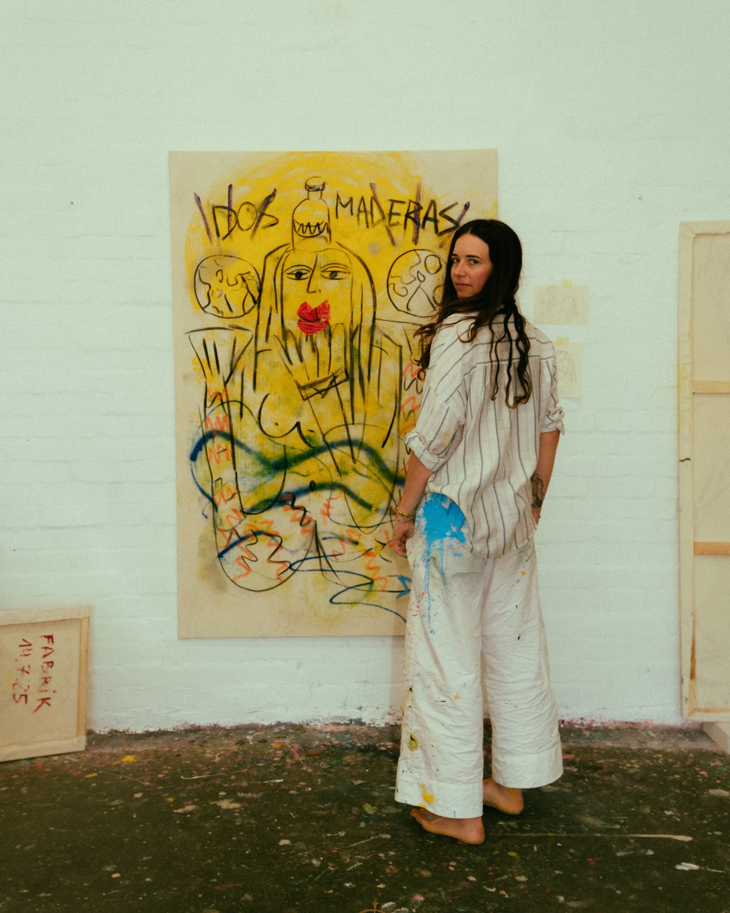Woman standing in front of a painting