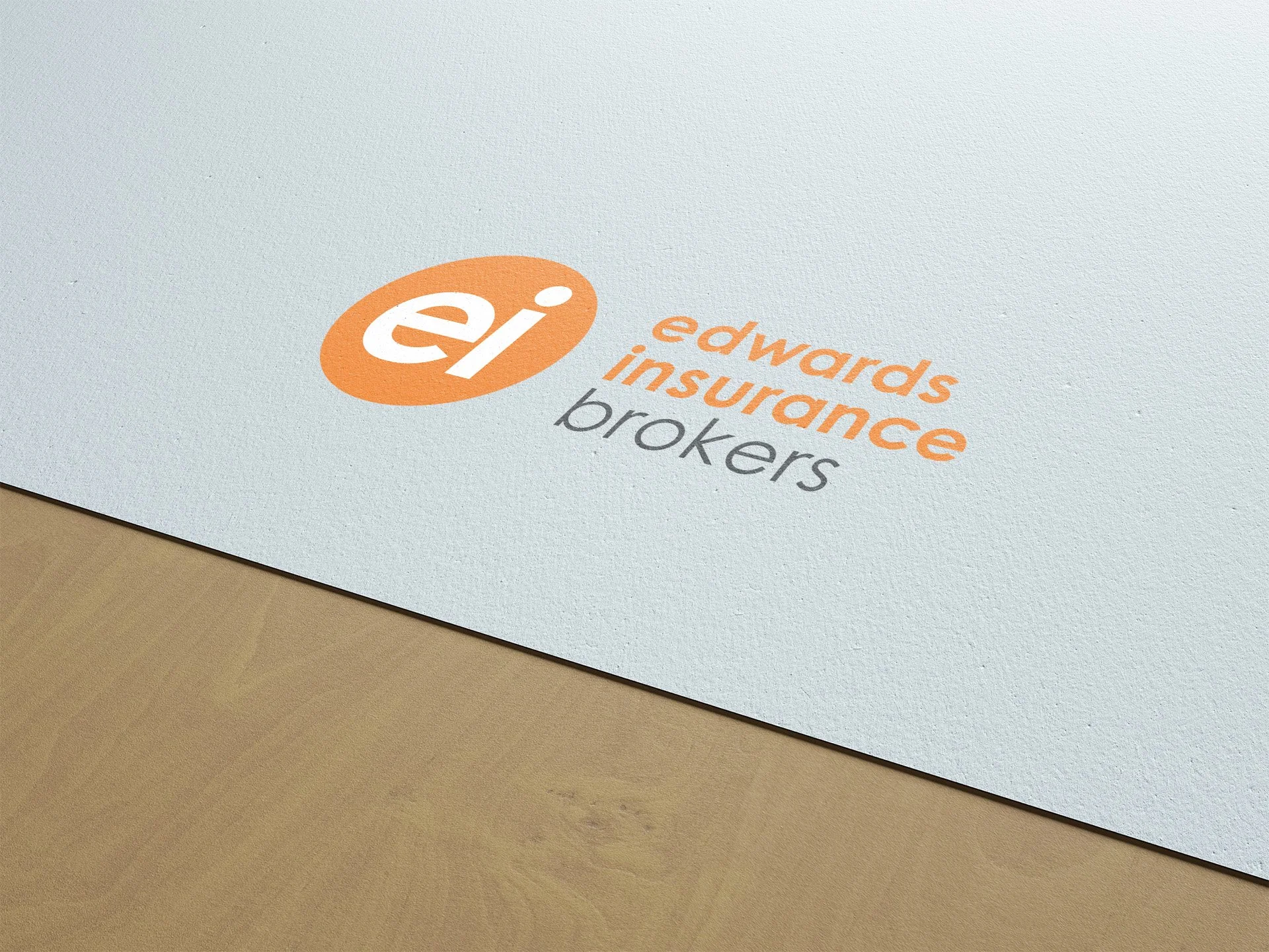 edwards logo displayed on paper, placed on an office table