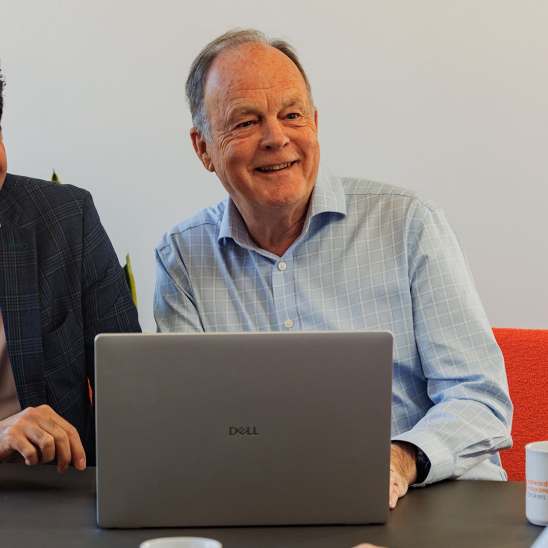 Richard smiling during a meeting at Edwards Insurance Brokers