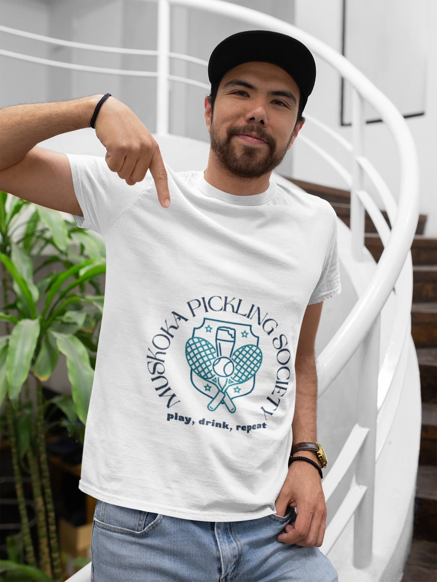 t-shirt-mockup-of-a-happy-customer-with-a-cap-at-the-end-of-a-staircase-26227(3).png