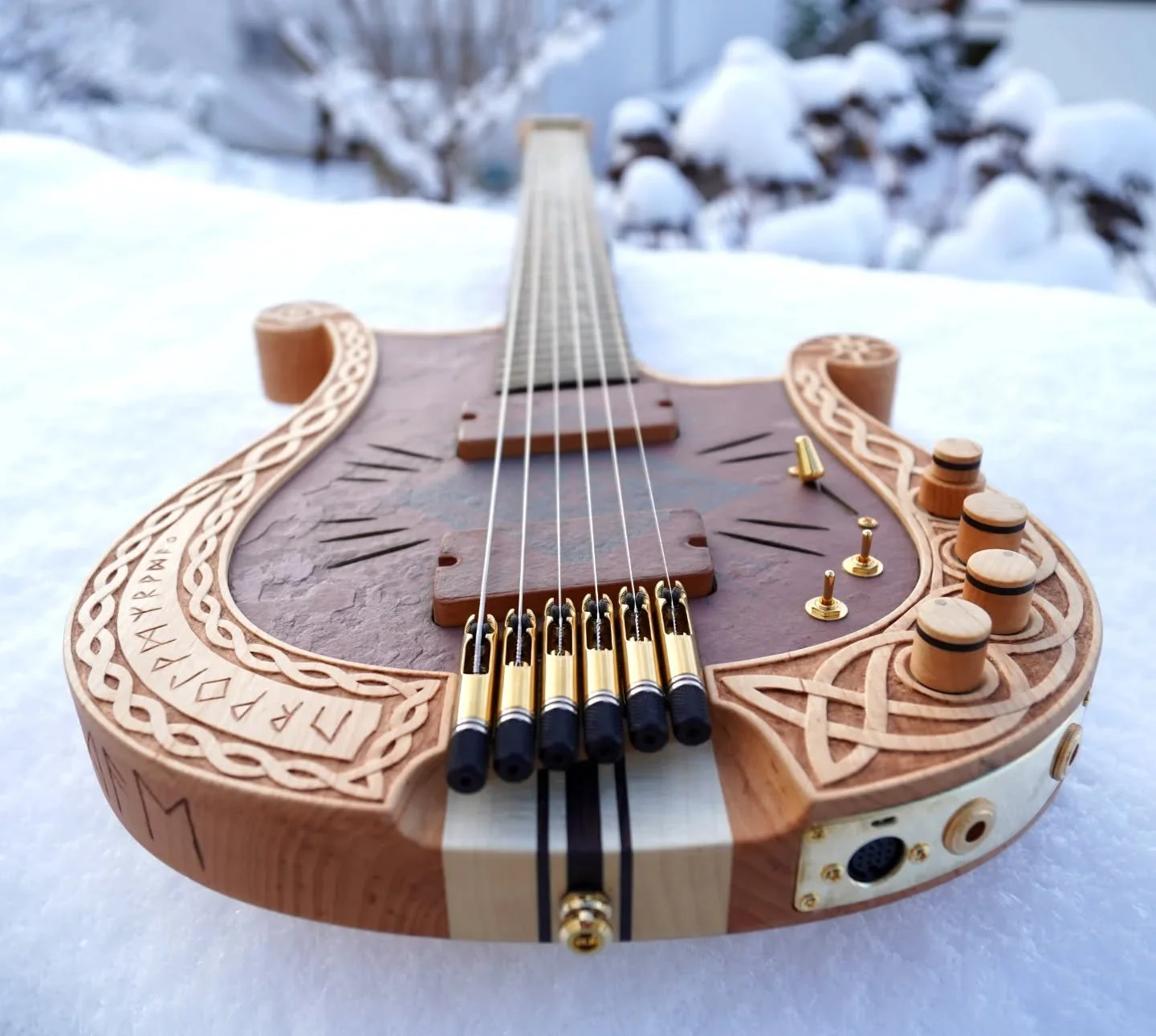 My most ambitious project to date is complete. This guitar was a lot of fun to design and build with an end result that is truly one of a kind. The client was involved at every step resulting in something that neither of us could have come up with on