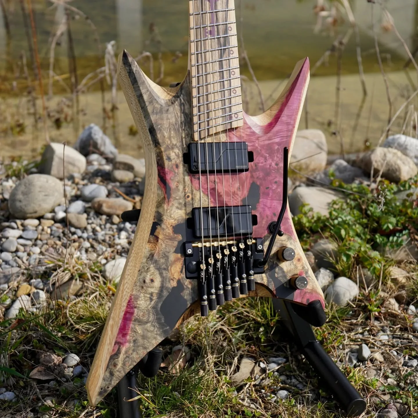 What a beast of a Necromancer build! I love the customer's idea to only stain the light parts of the top, creating a natural two tone effect. 
.
Specs:
- Necromancer 7
- 25.5-27in scale
- Black Limba body with Buckeye burl top 
- Maple, Purple heart,