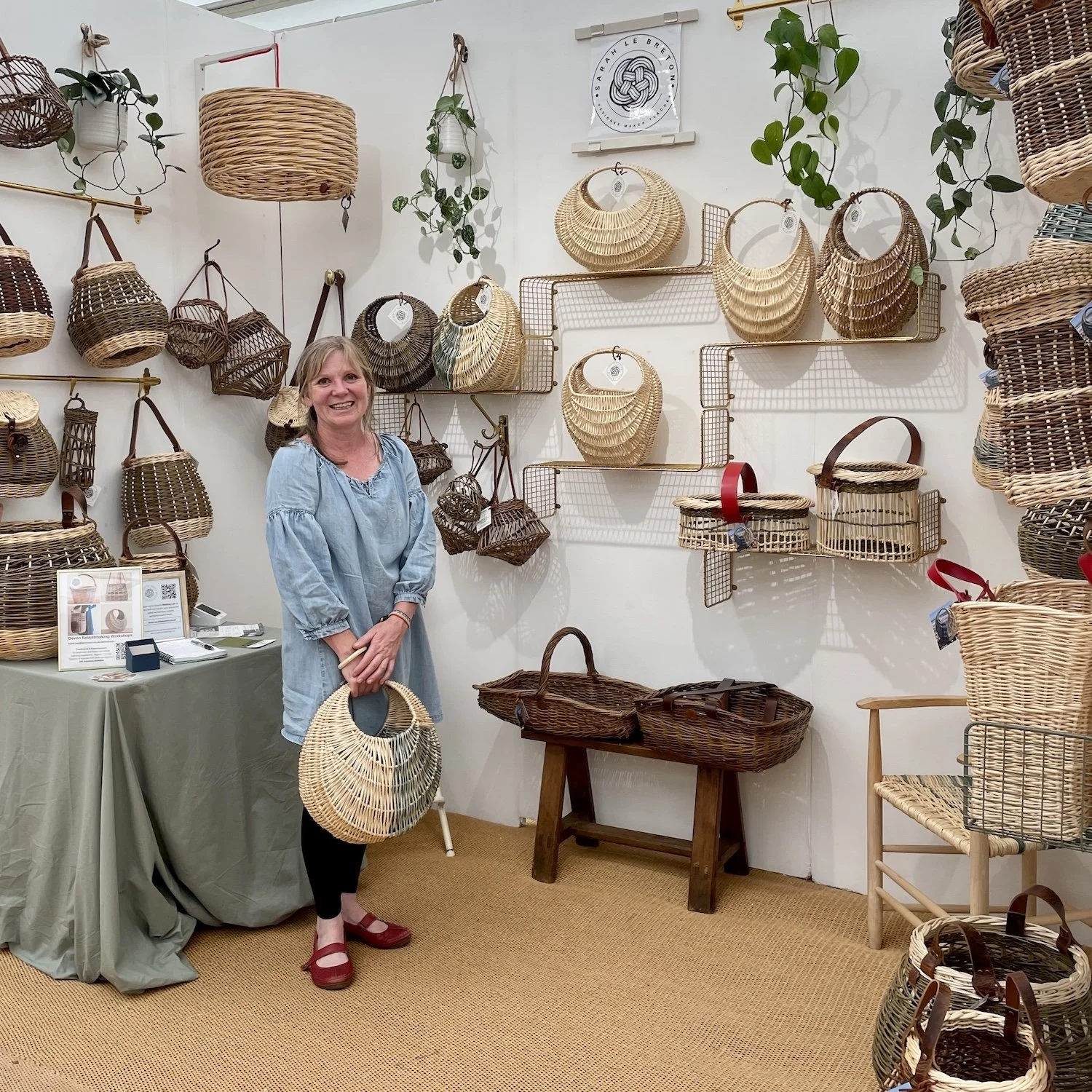 Sarah Le Breton stand exhibiting basket showcase at craft festival bovey tracey devon colourful willow baskets lighting features chair seating