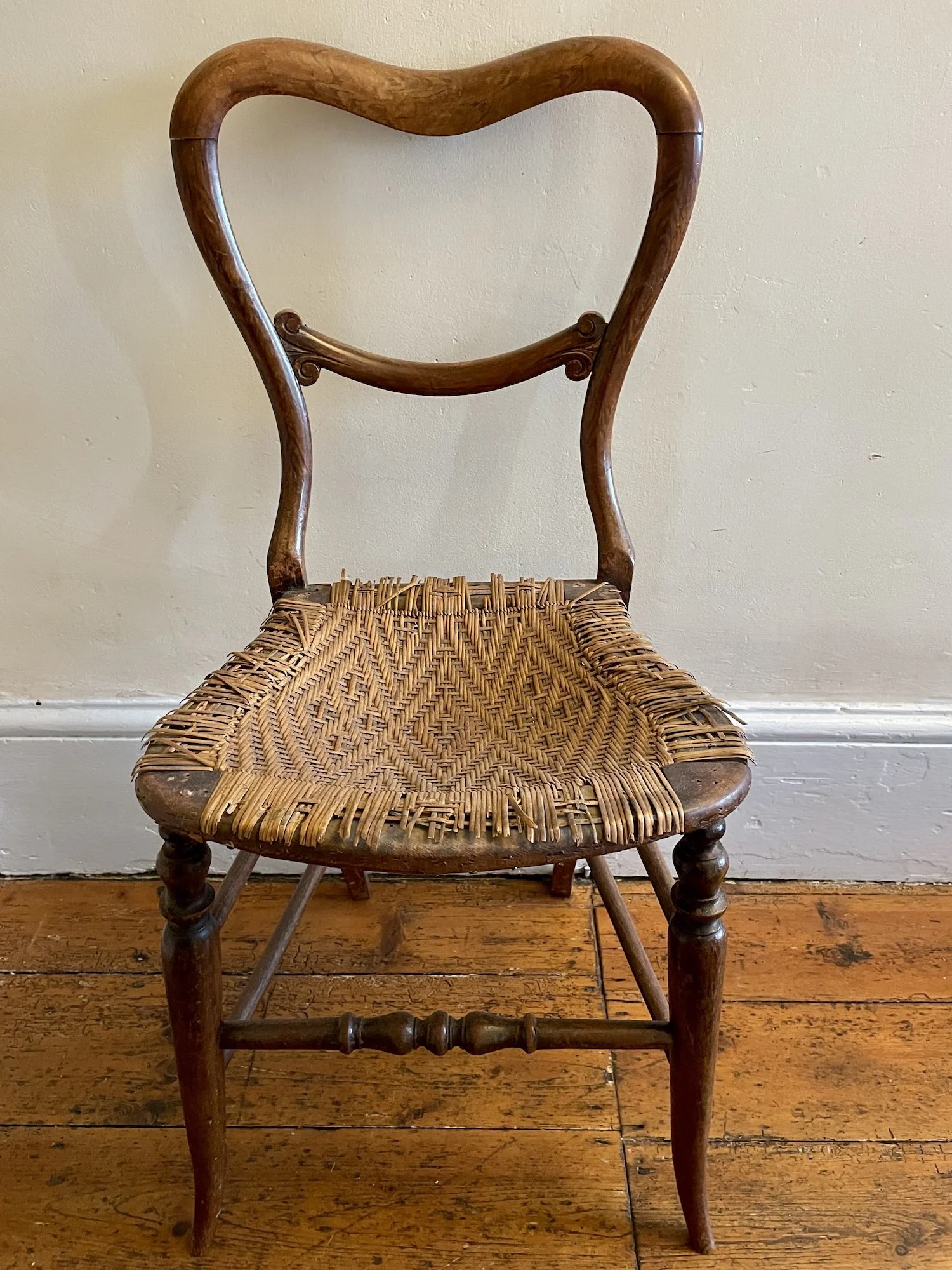 Antique ballon back chair with skein willow seat. mahogany