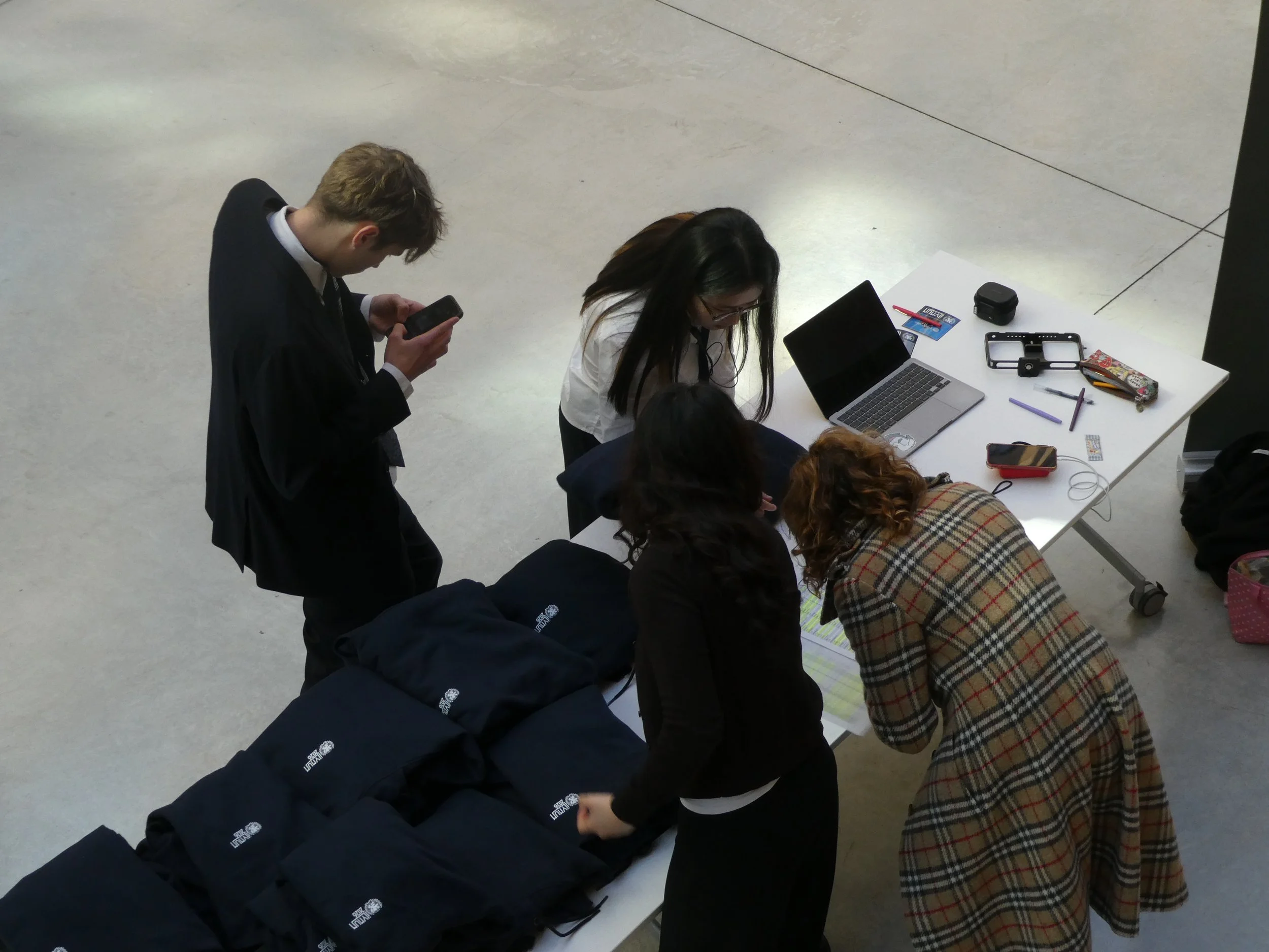 Heads of communications handing out hoodies.jpg