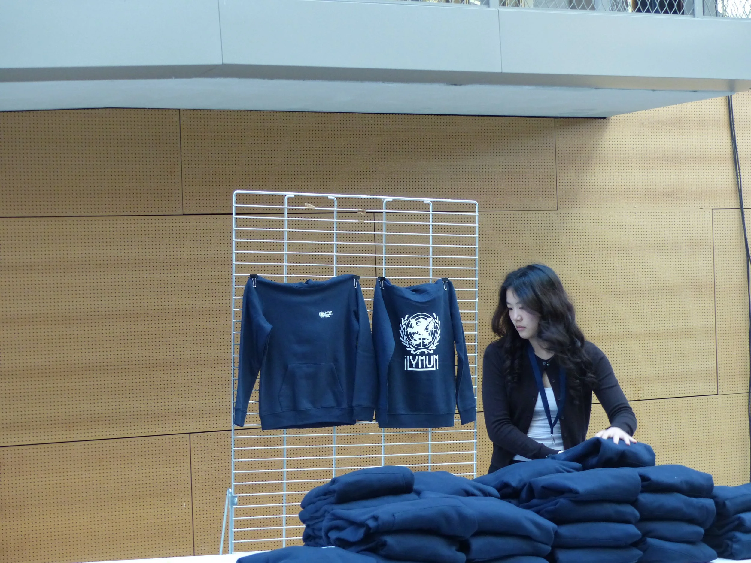 Helena distributing hoodies.JPG