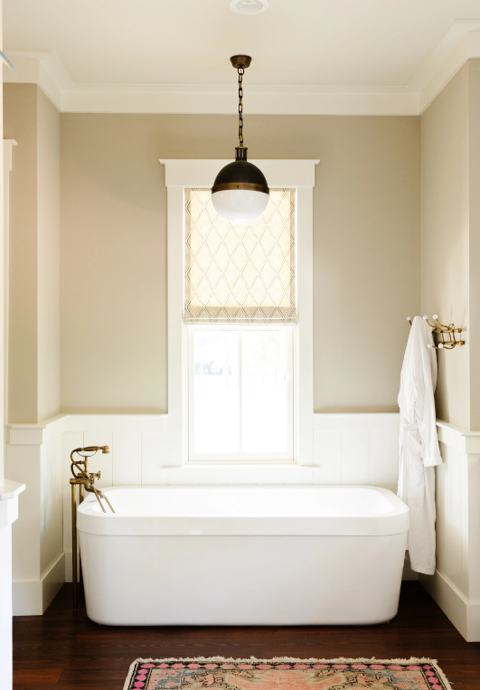 Neutral bathroom with beautiful bathtub in South Carolina custom home
