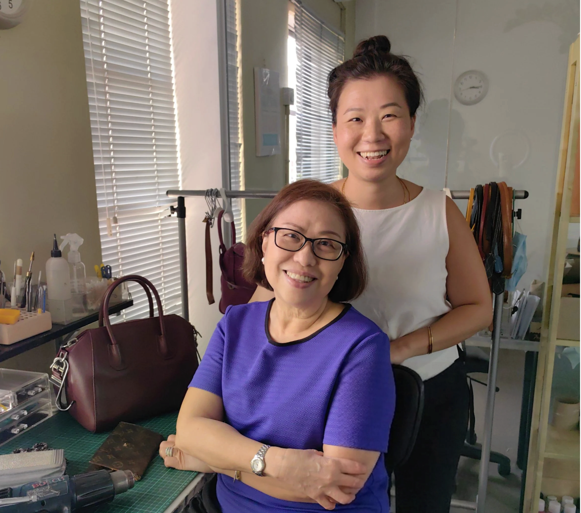 Mother-daughter team running Leather Biz, professional leather restorer of luxury handbags at studio based in Kuala Lumpur, Malaysia