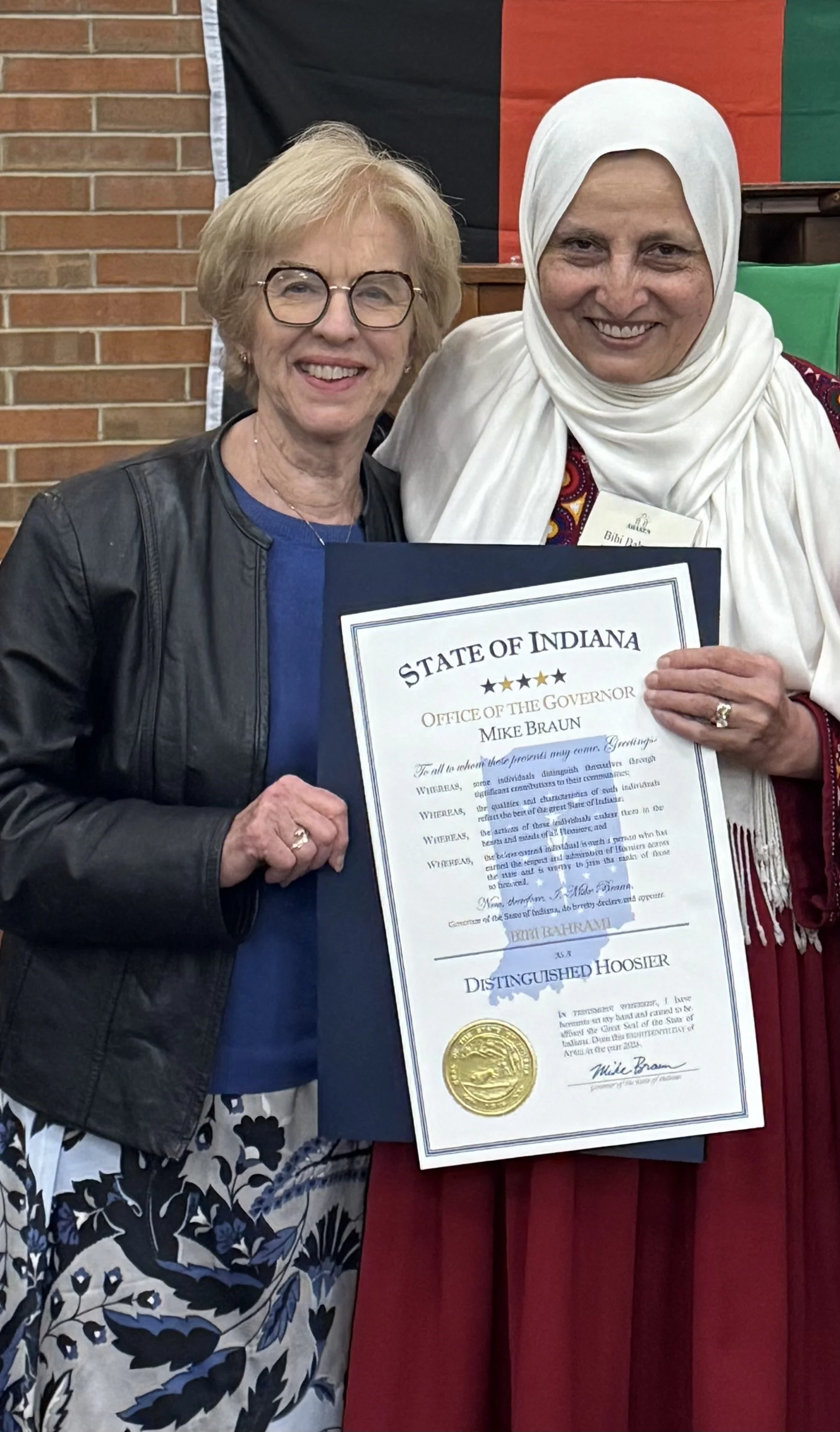 Errington presents ‘Distinguished Hoosier Award’ to Muncie non-profit leader Bibi Bahrami