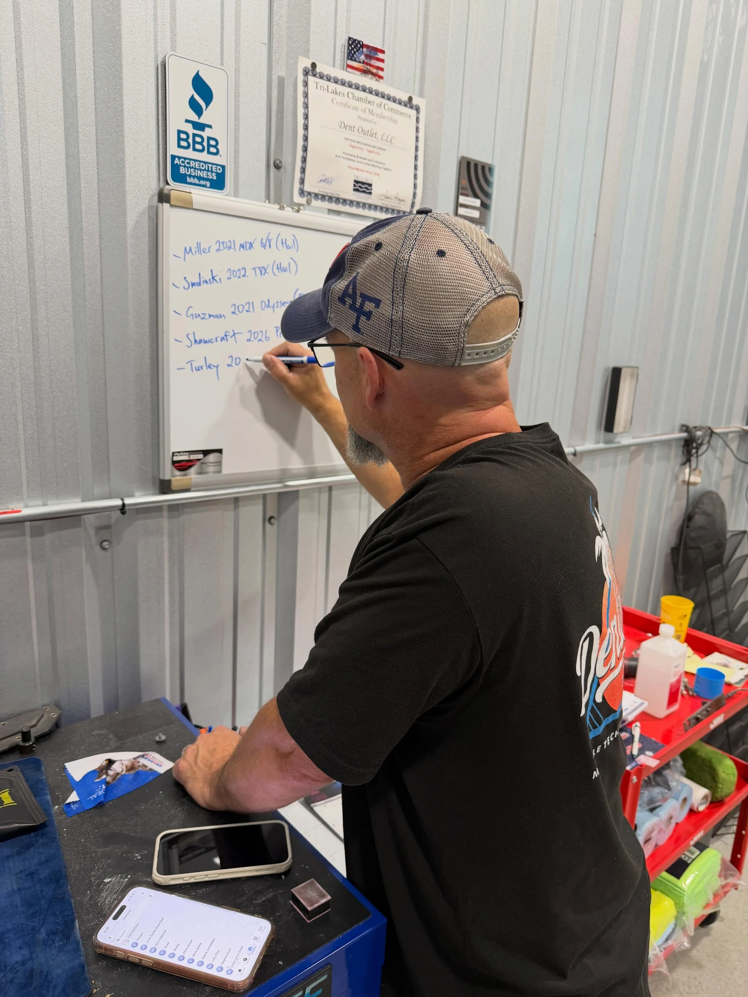 Making a list. Checking it twice. Gonna help our friends who got hit by falling ice. Just got a couple in from Woodmoor. If you were in the wrong place at the right time. Give the Tri-Lakes top rated PDR (Paintless Dent Repair) shop a call at 719-650