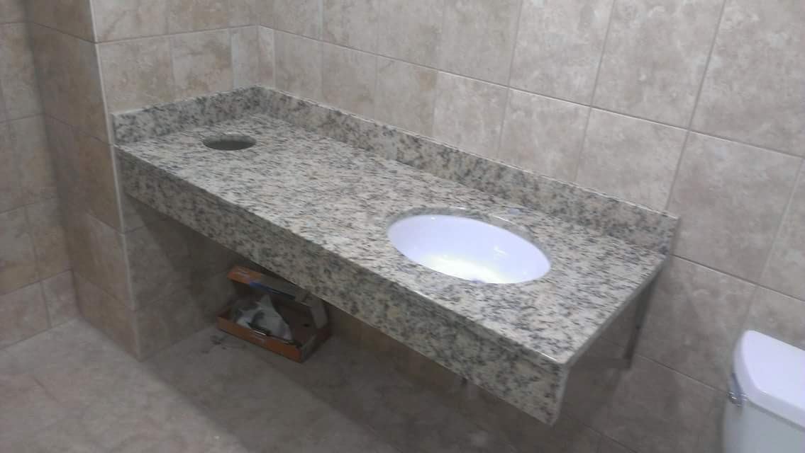 Bathroom with granite countertop and sink