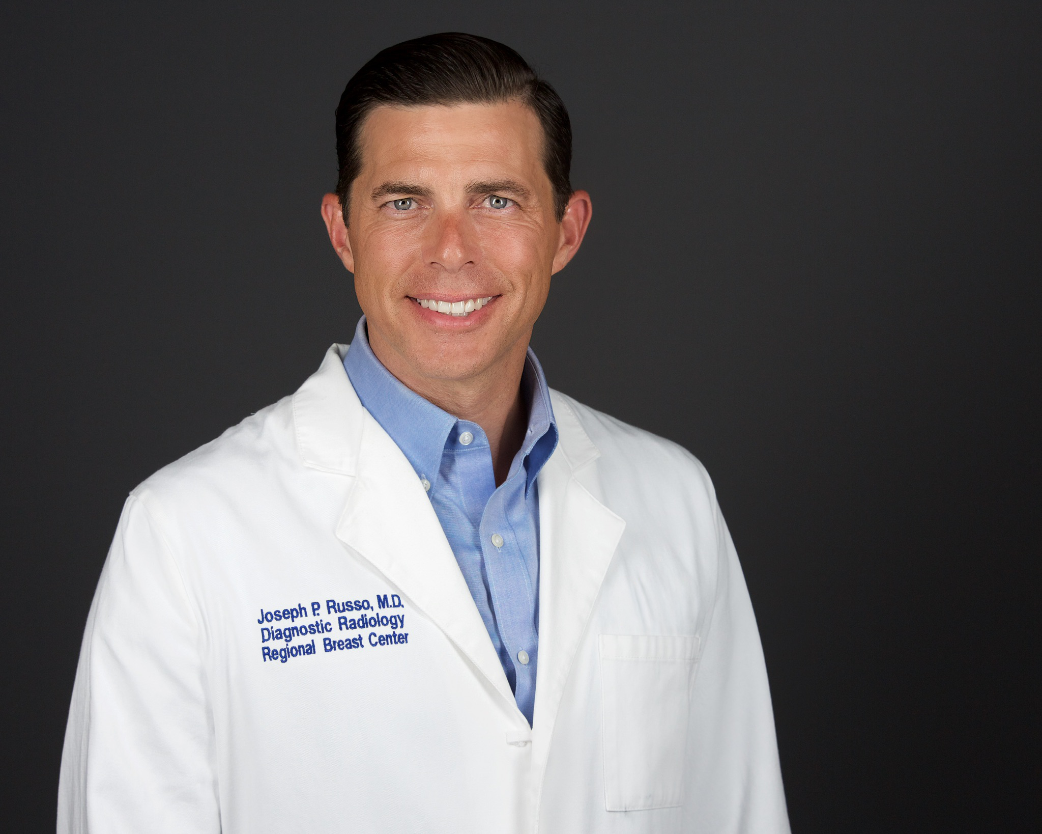 Joe+Russo_White+Coat_Headshot_SL+Removed.png.webp