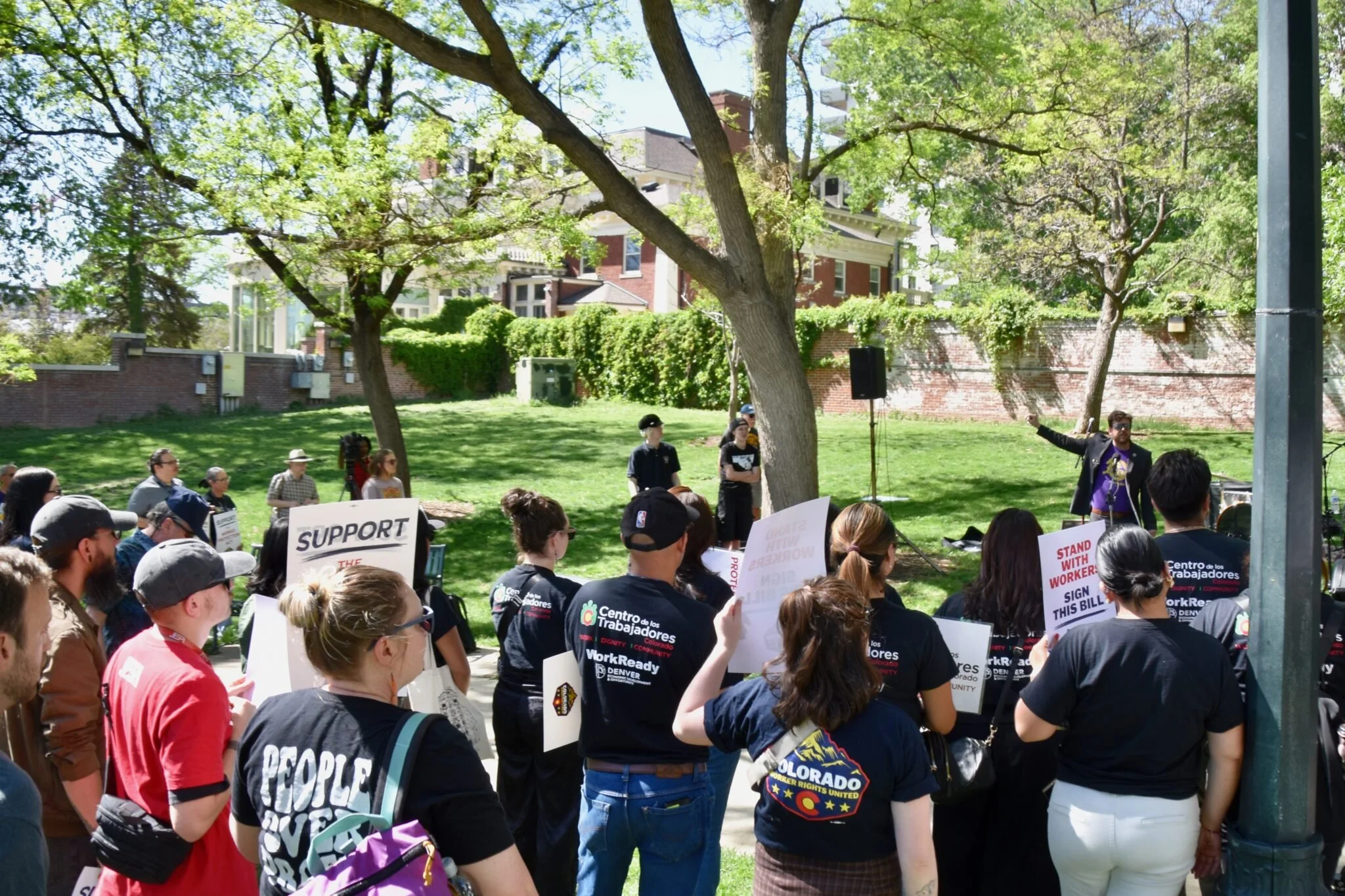 Workers rally outside the Governor's residence in Colorado
