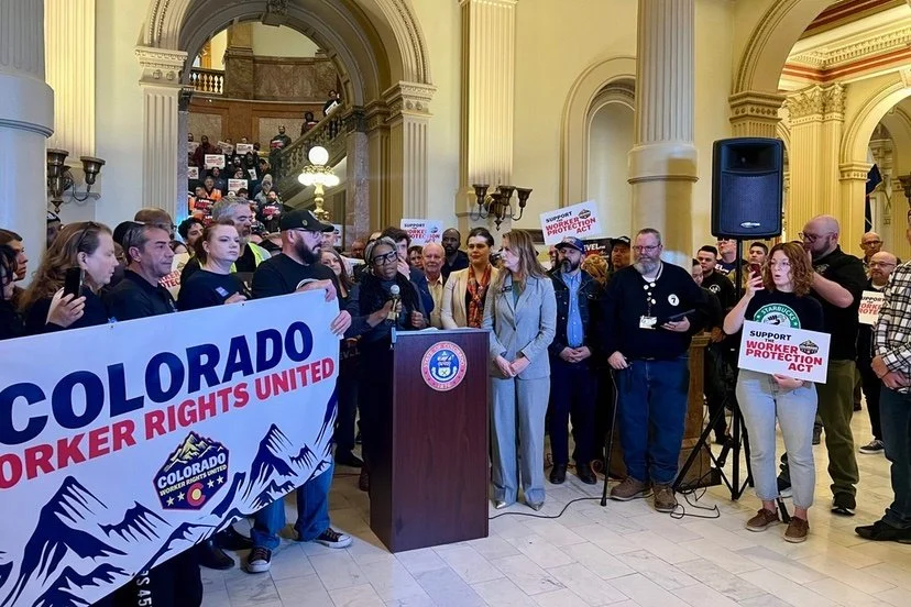 Group of people rally at the capitol for Colorado Worker Rights United