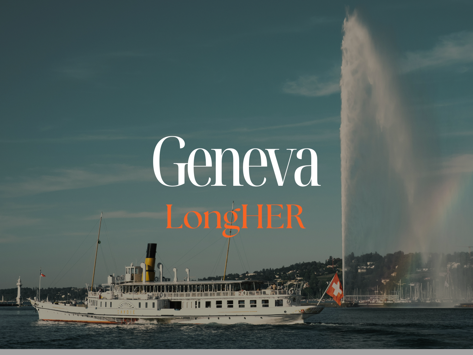 A boat sailing on a body of water with a fountain spraying water high into the sky and a small lighthouse in the background, under a partly cloudy sky.