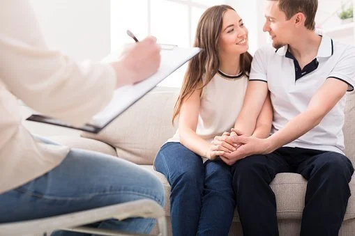 young couple with doctor