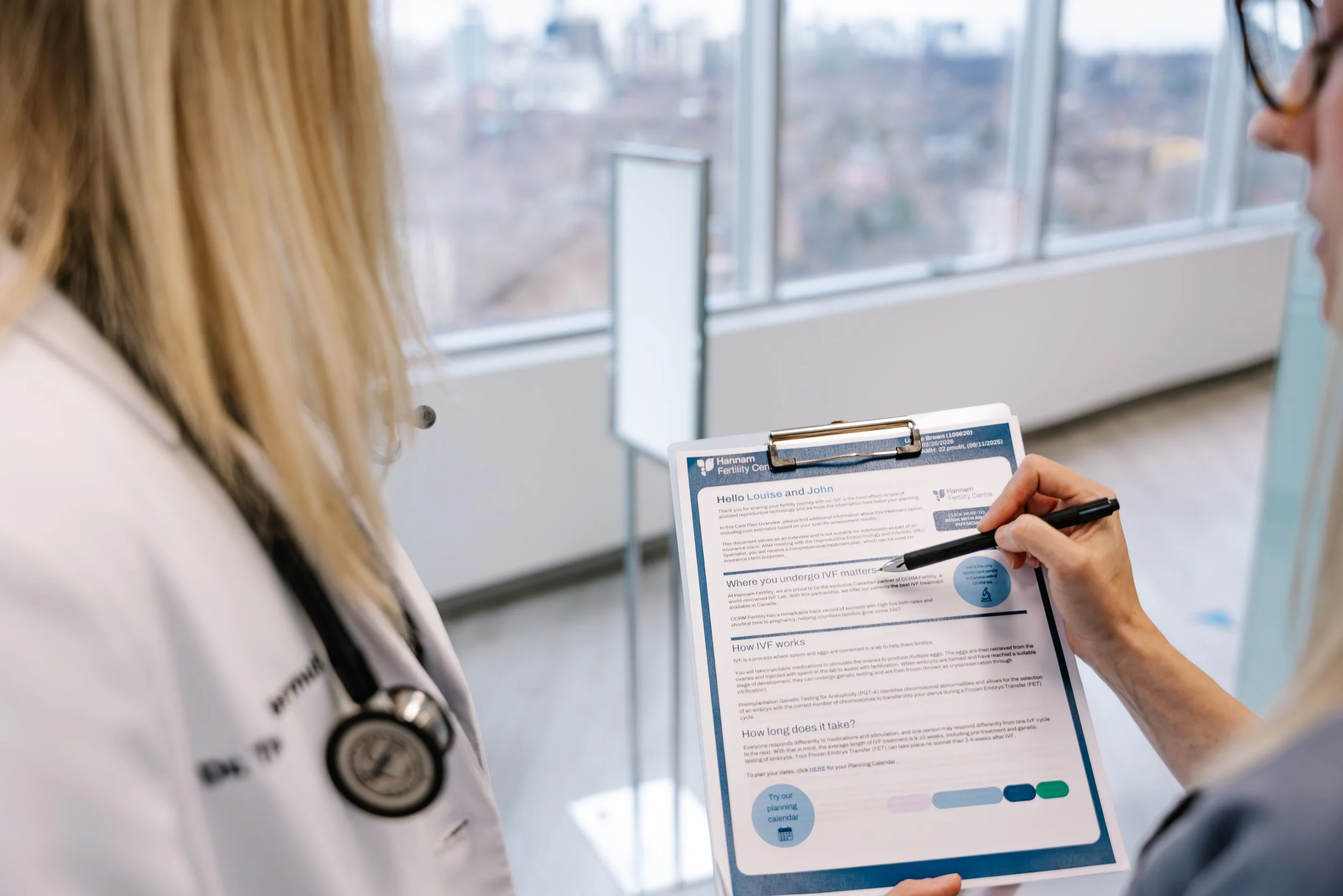 Clinicians reviewing IVF treatment plan at Hannam Fertility Centre