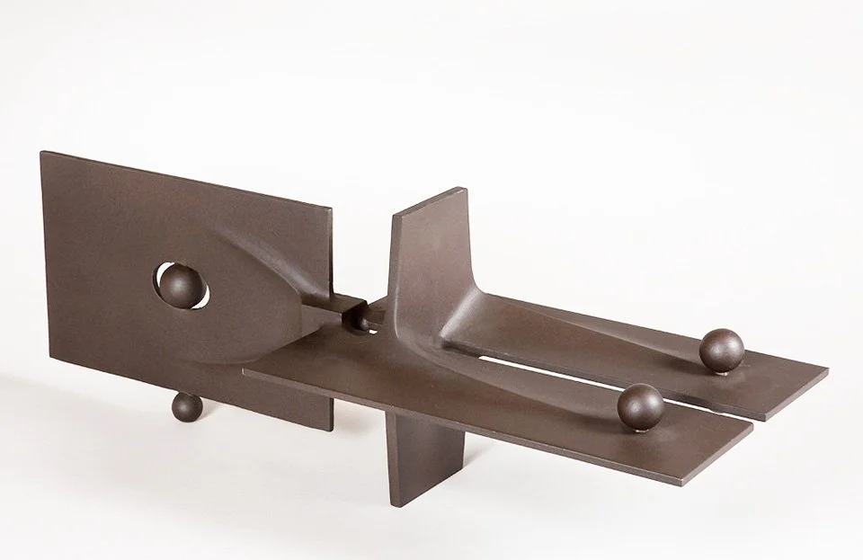 Abstract metal sculpture by Angelo Granata with geometric shapes and spherical elements