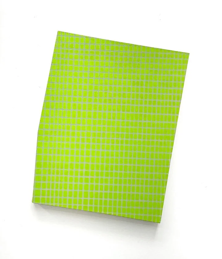 Green painting with a pattern of small, shiny green squares on its surface placed on a white background.