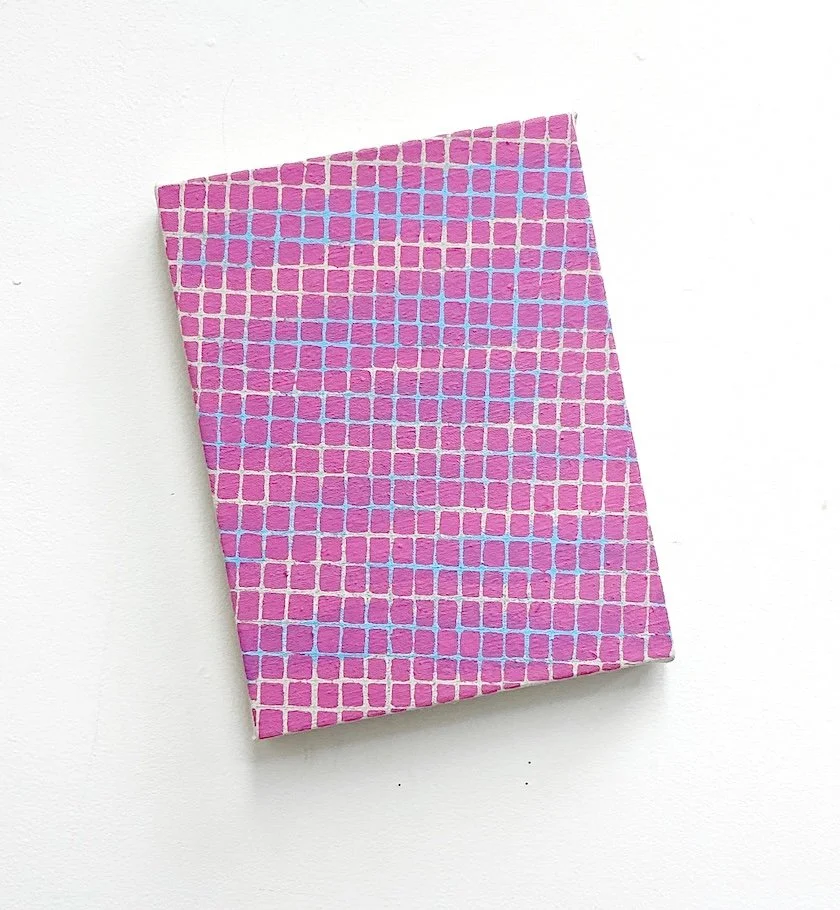A small rectangular canvas with a pink and purple mosaic pattern.