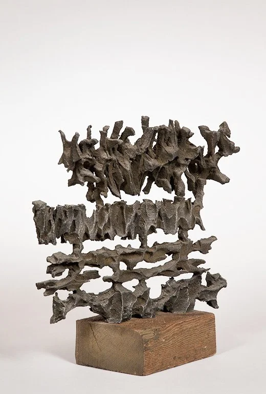 Abstract metal sculpture by Angelo Granata on wooden base