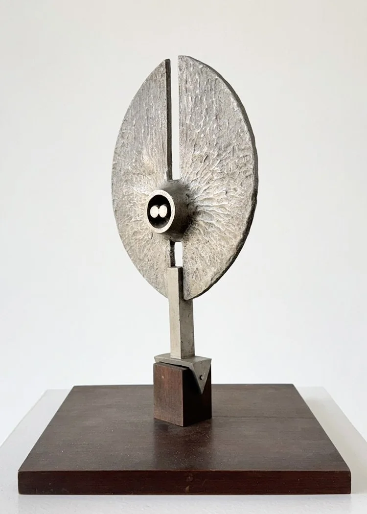 Abstract metal sculpture by Angelo Granata with circular split disc