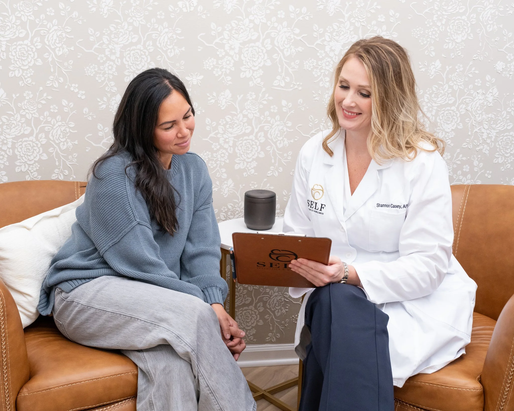 Nurse practitioner consulting with client for BHRT