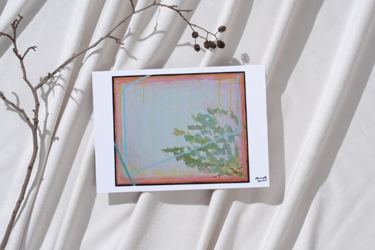 "This Must Be the Place (2)" print within a pile of postcards.