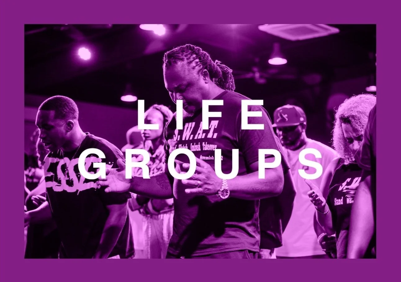 A group of people praying or kneeling with their hands folded or clasped, illuminated with purple lighting, with the words 'LIFE GROUPS' overlaid in white text.