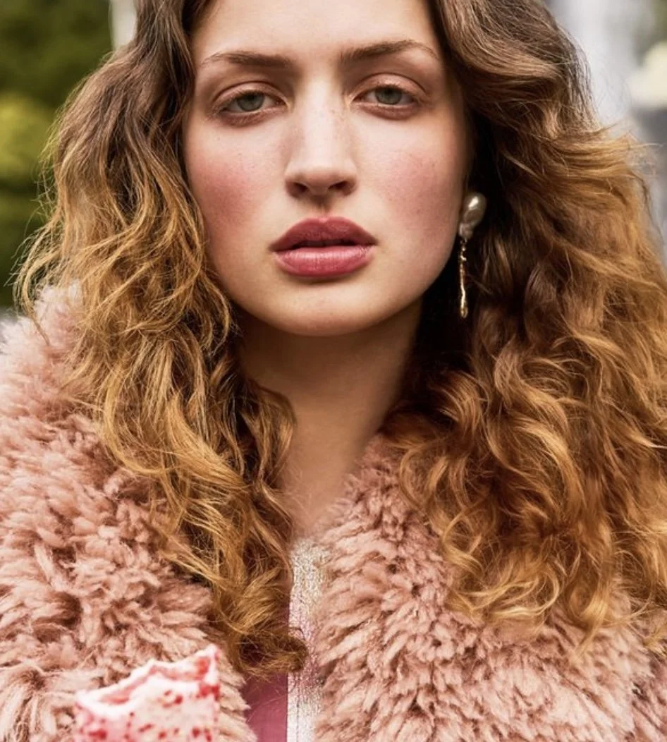 Gorgeous model with golden skin and smoky eyes 