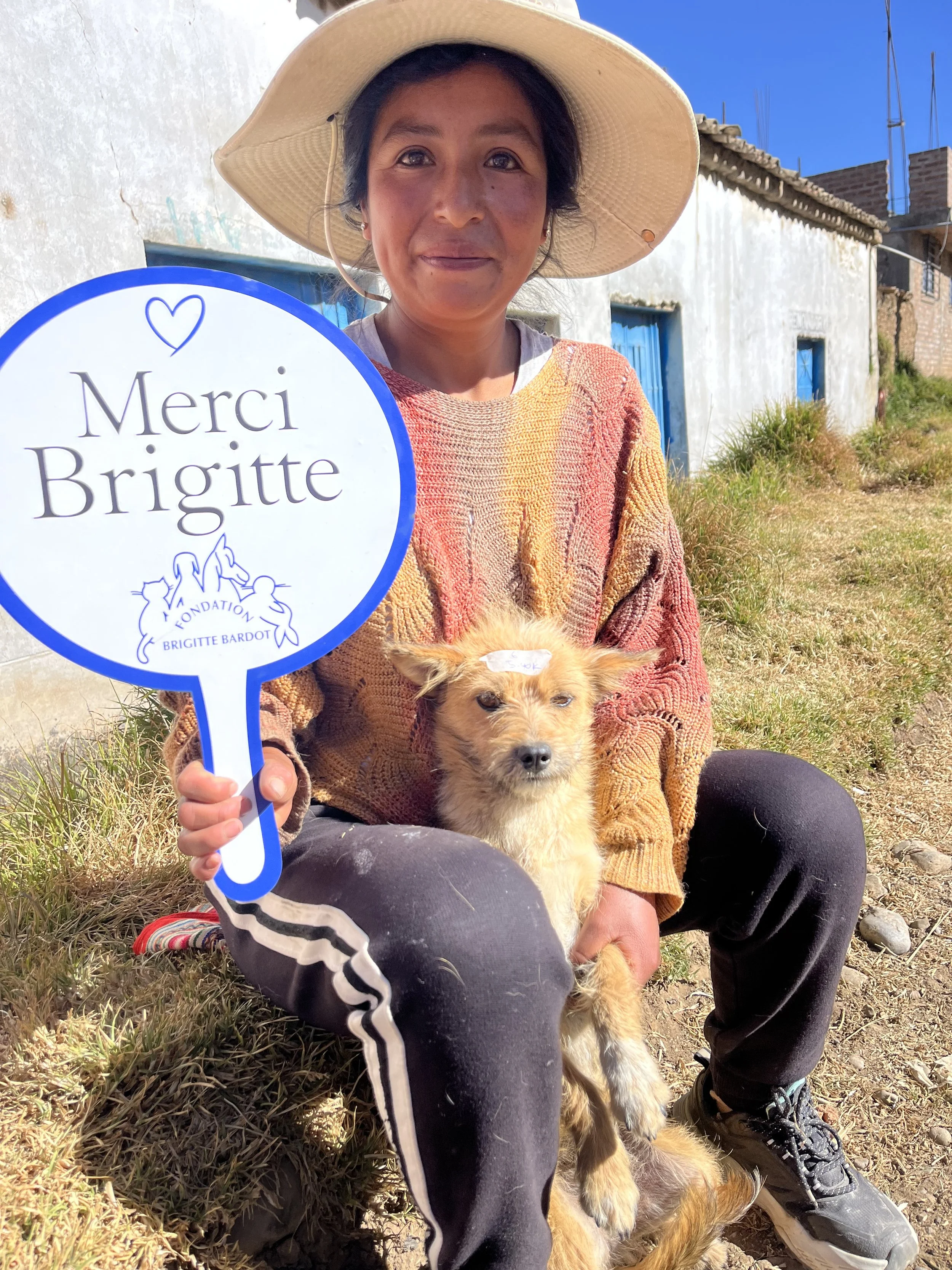 Woman with rescue dog and Brigitte sign