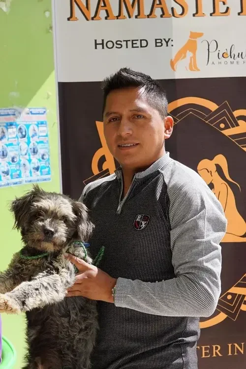 Man holding an adopted rescue dog